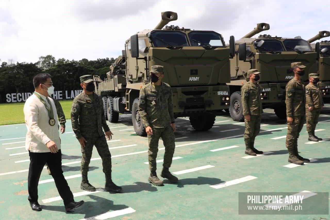 Department of National Defense Officer-in-Charge Senior Undersecretary Jose C. Faustino, Jr.,  inspects the Autonomous Truck Mounted Howitzer System (ATMOS) 155mm self-propelled guns during the send-off ceremony of the 10th Field Artillery "Rolling Thunder" Battalion on September 21, 2022.