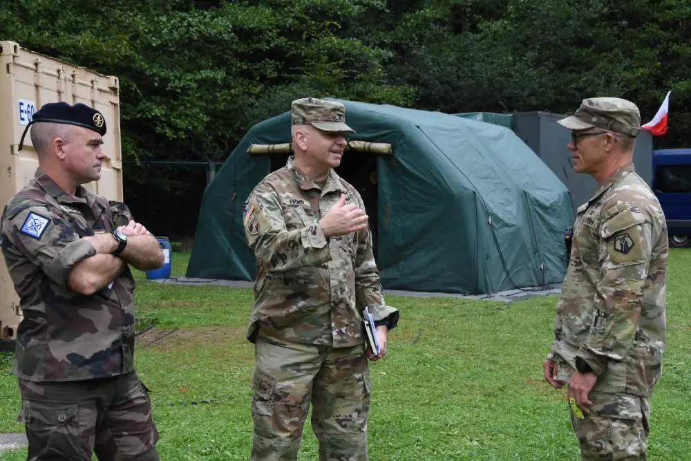 U.S. Army Col. Michael Firmin, (center) director of Education, Training and Evaluation Department at the NATO Joint CBRN Defence Centre of Excellence in Vyškov, Czechia talks with French Army Lt. Col.Yan Perron, NATO Joint CBRN Defence Centre of Excellence, and U.S. Army Lt. Col. Blair Heath, nurse practitioner with the 773rd Civil Support Team, during Exercise Toxic Valley 2022. 
