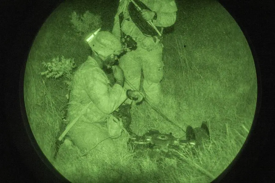 Soldiers from the 59th Combat Engineer Company-Armored, 36th Engineer Brigade emplace an XM204 Top Attack Munition in support of a complex obstacle under night conditions on Fort Hood, Texas during an operational assessment. The XM204 is the Army’s newest explosive in Soldier hands that will help Engineers shape the battlefield. (Mr. Tad Browning, Audiovisual Production Specialist, U.S. Army Operational Test Command)