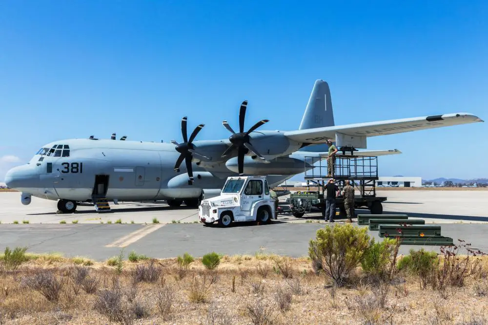 U.S. Marines with Marine Aerial Refueler Transport Squadron (VMGR) 252 prepare to equip AGM-114 Hellfire missiles to a KC-130J Hercules at Marine Corps Air Station Miramar, California. 