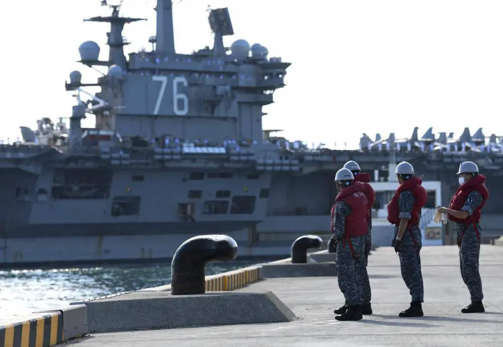 Republic of Korea Navy Sailors prepare to moor the U.S. Navy’s only forward-deployed aircraft carrier USS Ronald Reagan (CVN 76) in Busan, Republic of Korea.