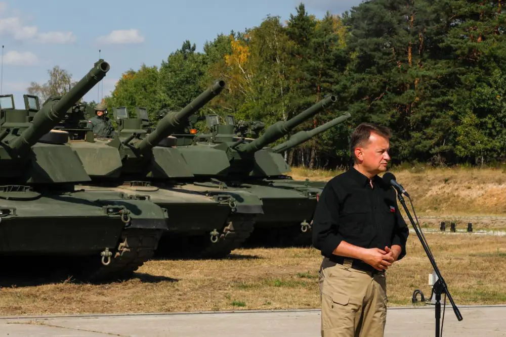 Polish Defense Minister Mariusz B?aszczak gives a speech during the opening ceremony of the Abrams Tank Training Academy at Biedrusko, Poland, Aug. 10, 2022. 
