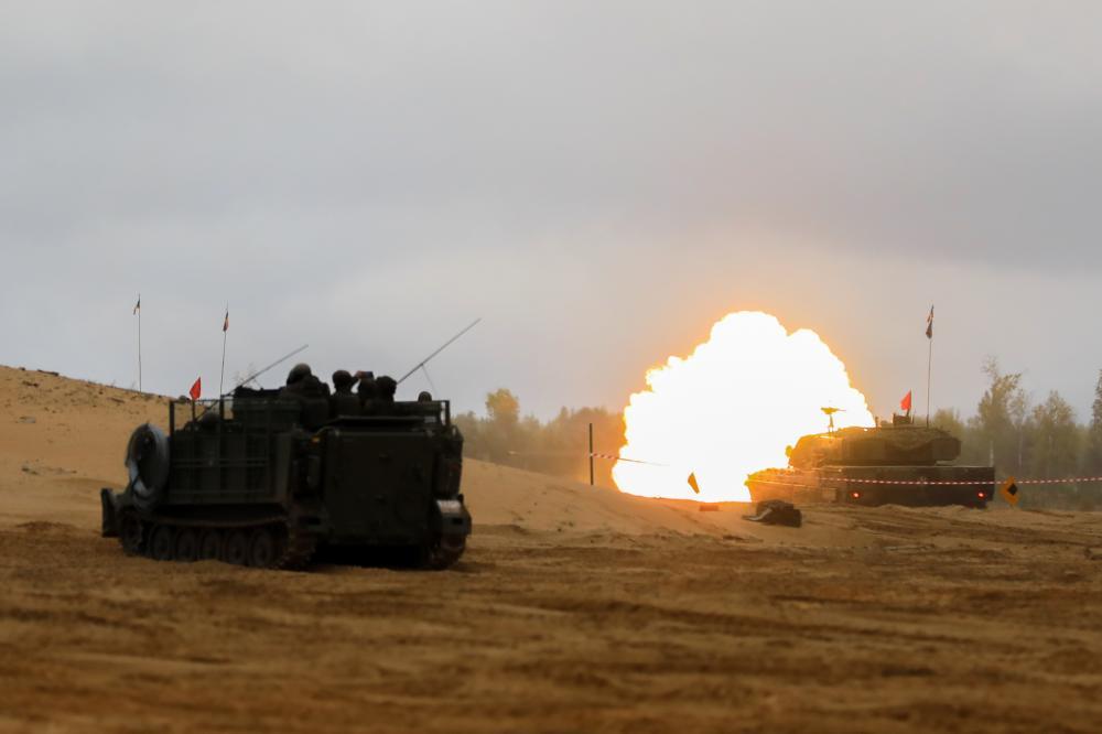 A NATO Enhanced Forward Presence Battle Group vehicle fires a mortar round as part of a live-fire demonstration at the closing event for Exercise Silver Arrow 2022 at Camp Adazi, Latvia, Sept. 29, 2022. (U.S. Army National Guard photo by Sgt. Lianne M. Hirano)