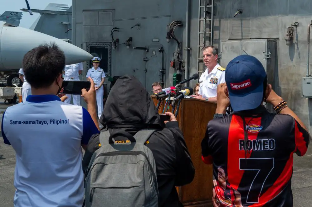 Rear Adm. Buzz Donnelly, Commander, Carrier Strike Group (CSG) 5, speaks at a press conference on the flight deck of the U.S. Navy’s only forward-deployed aircraft carrier, USS Ronald Reagan (CVN 76), as the ship is anchored in Manila Bay, Philippines, October 14.