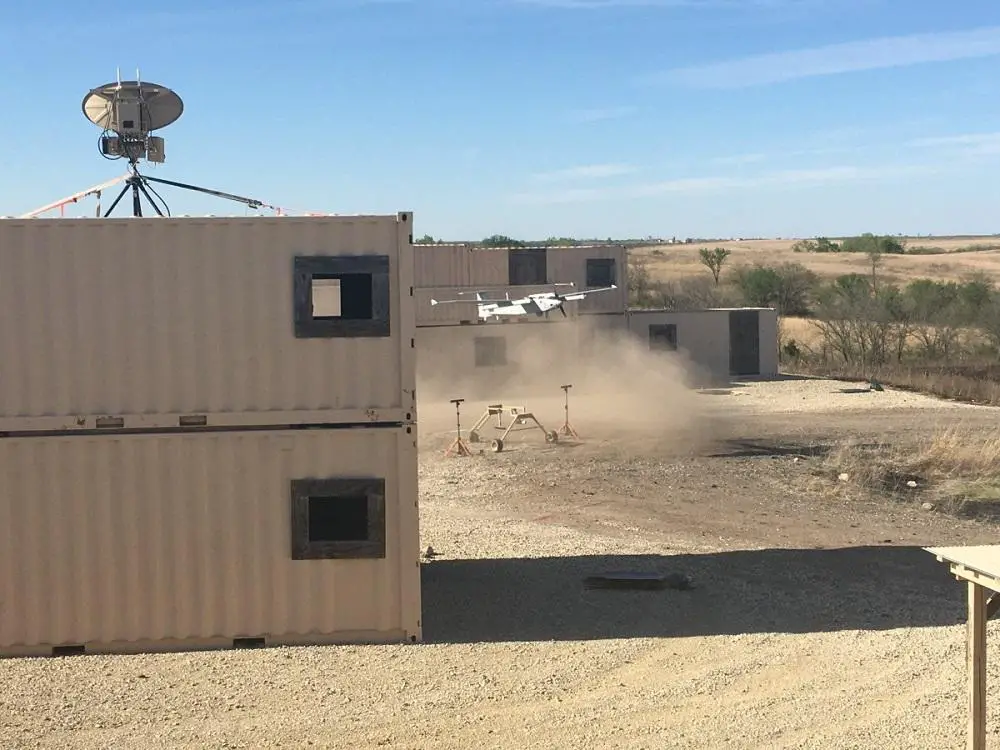 Soldiers from the 1st Armored Brigade Combat Team, 1st Infantry Division, execute the air vehicle control handoff capabilities with the AeroVironment, Inc's JUMP 20 in a simulated urban environment during the Army's FTUAS capability assessment, at Fort Riley, Kansas.  (Photo by Jonathan Koester)