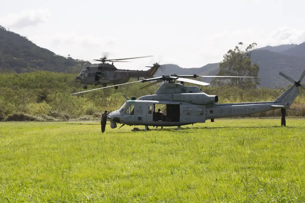 U.S. Marines with Marine Light Attack Helicopter Squadron - 773, 4th Marine Aircraft Wing, Marine Forces Reserve in support of Special Purpose Marine Air-Ground Task Force UNITAS LXIII, observe a Brazilian UH-15 Super Cougar take off from the parachute operations loading zone at Santa Cruz Air Force Base, Rio de Janeiro, during exercise UNITAS LXIII, Sept. 6, 2022.