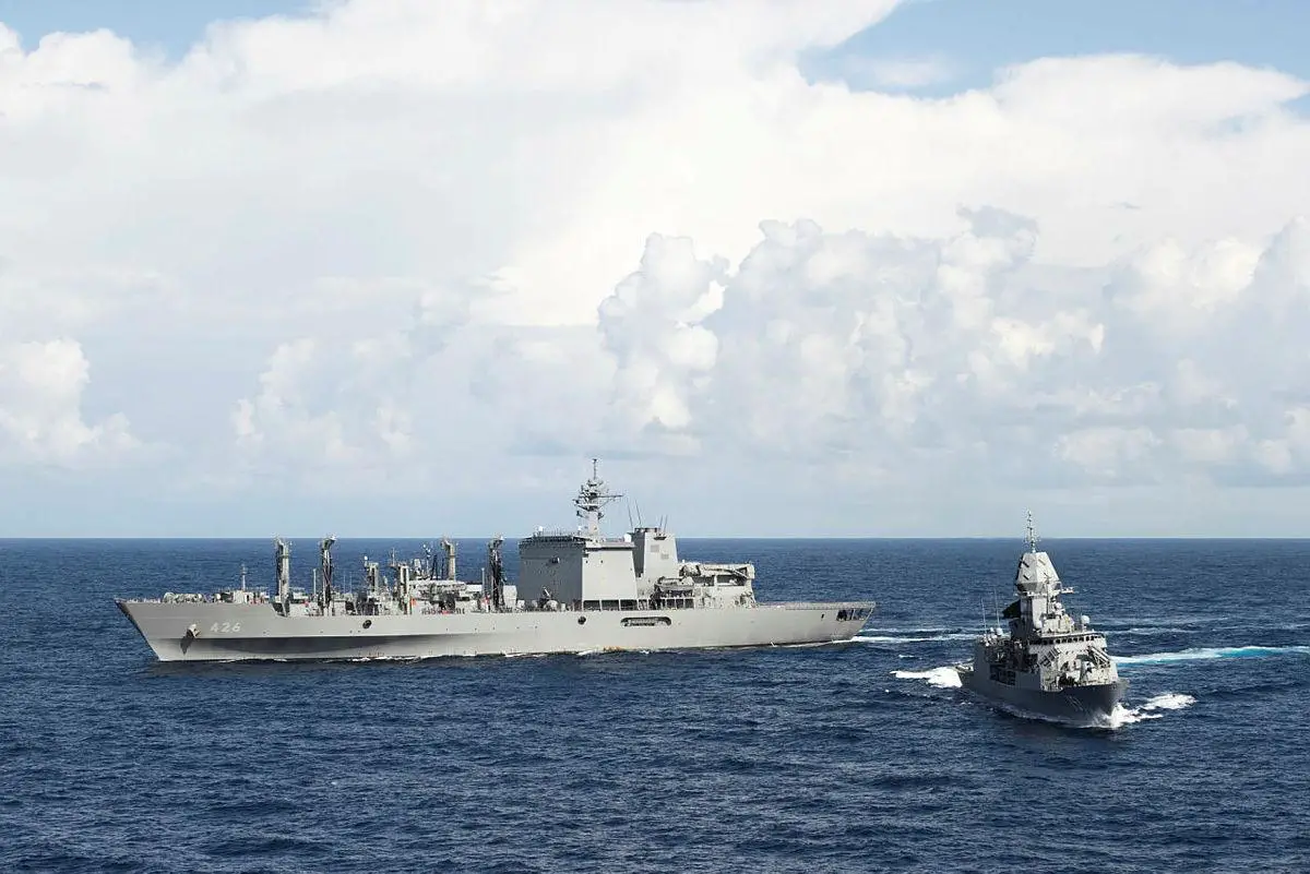 HMAS Arunta (right) breaks away from a duel Replenishment at Sea during Exercise Malabar 2022.