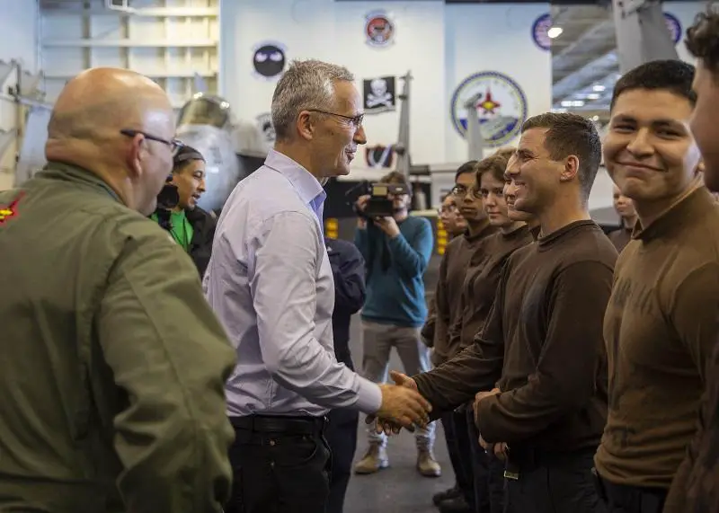 Jens Stoltenberg, Secretary General of NATO, speaks with Sailors aboard the Nimitz-class aircraft carrier USS George H.W. Bush (CVN 77) during the NATO-led vigilance activity Neptune Strike 2022.2 (NEST 22.2), Oct. 25, 2022. NEST 22.2 is the natural evolution of NATO's ability to integrate the high-end maritime warfare capabilities of a carrier strike group to support the defense of the alliance in Europe.