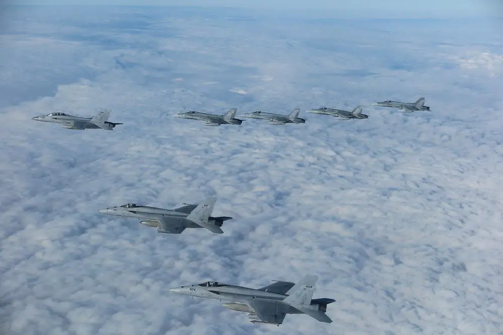 Three F/A-18E Super Hornet aircraft assigned to Carrier Air Wing (CVW) 7 and four CF-18 Hornet aircraft assigned to the Royal Canadian Air Force fly in formation over Romania during the NATO-led vigilance activity Neptune Strike 22.2 (NEST 22.2), Oct. 14, 2022. NEST 22.2 is the natural evolution of NATO's ability to integrate the high-end maritime warfare capabilities of a carrier strike group to support the defense of the alliance in Europe.

