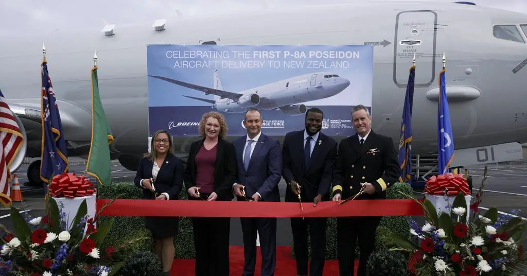 To commemorate the delivery of the first P-8A Poseidon for New Zealand, the U.S. Navy, New Zealand delegates and Boeing leaders cut the ribbon Wednesday in Seattle. Pictured (from left) are Sheena Vince Cruz, Boeing P-8 Asia-Pacific region program manager; Sarah Minson, acting Deputy Secretary Capability Delivery, New Zealand Ministry of Defence; Jeremy Clarke-Watson, New Zealand Consul General to Los Angeles; and Philip June, Boeing P-8 vice president and general manager; Rear Admiral Anthony E. Rossi, director, Navy International Programs Office
