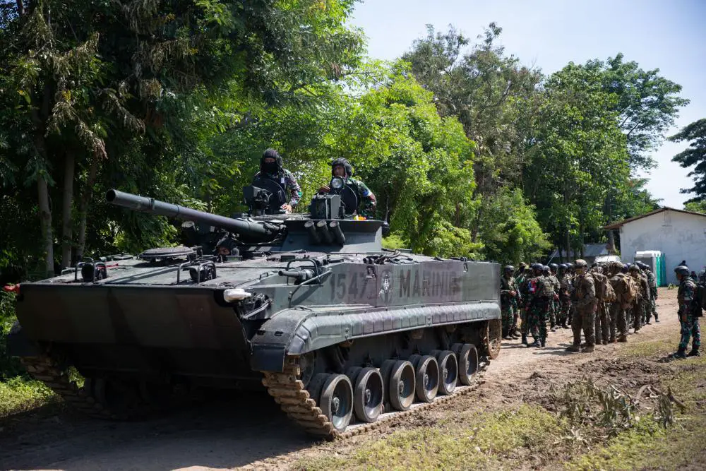 Indonesian Marine Corps BMP-3F infantry fighting vehicle leads a simulated assault with U.S. Marines from Battalion Landing Team 2/4, 13th Marine Expeditionary Unit, during Cooperation Afloat Readiness and Training/Marine Exercise Indonesia 2022, Dec. 20. 