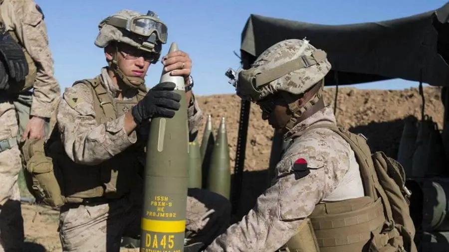 The U.S. Marine Corps prepare an Excalibur® 155 mm projectile round on Fire Base Bell, Iraq, while conducting fire missions. (Photo by U.S. Marine Corps)