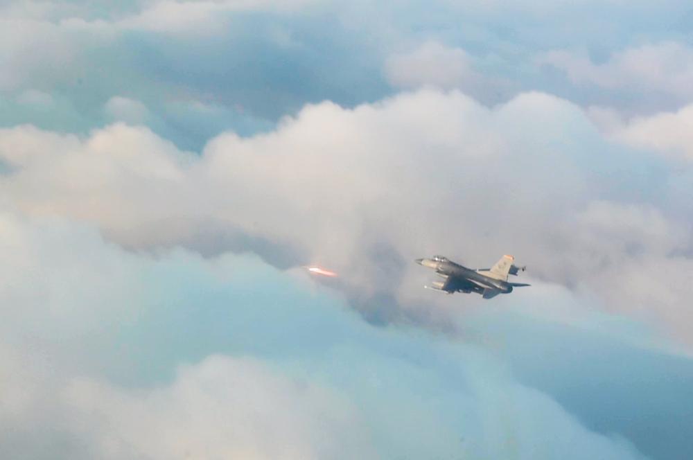 An 8th Operations Group F-16 Fighting Falcon fires an AIM-9 missile at a simulated adversary during a training in the skies near Kunsan Air Base, Republic of Korea, Dec. 1, 2022.