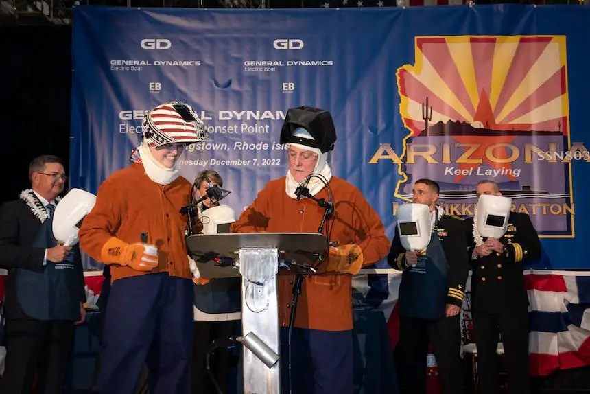Ship Sponsor Nikki Stratton (left foreground) and Electric Boat welder Bob Hobday prepare to weld Stratton's initials into a plate that will be placed on the future USS Arizona (SSN 803), during the boat's keel authentication ceremony at the Electric Boat Quonset Point Facility in North Kingstown, R.I., Dec. 7. The submarine will be the first U.S. naval vessel to bear the name Arizona since battleship USS Arizona (BB 39) was sunk during the Japanese attack on Pearl Harbor on Dec. 7, 1941.
