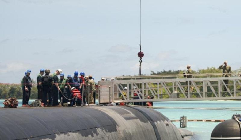 Sailors assigned to the Ohio-class ballistic-missile submarine USS West Virginia (SSBN-736) salute while crossing the brow during a scheduled port visit at U.S. Navy Support Facility (NSF) Diego Garcia. 
