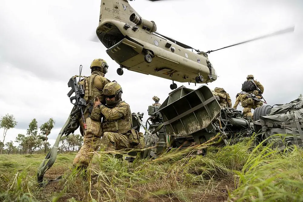 Australian Army soldiers from the 4th Regiment, Royal Australian Artillery, prepare the M777 Howitzer to be transported by the CH-47F Chinook from the 5th Aviation Regiment in Townsville Field Training Area, Queensland.
