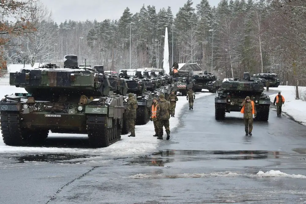 German Army Leopard 2A7 main battle tanks with the 104th Tank Battalion move onto carts during railhead operations at Rose Barracks, Vilseck, Germany. Germany supports the NATO’s Enhanced Forward Presence Battlegroup in Lithuania. 