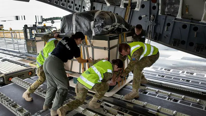 Air Force 36 Squadron loadmasters and Army 176 Air Dispatch Squadron soldiers load supplies onto a C-17A Globemaster at Hobart International Airport, to be airdropped into Antarctica. Photo: Leading Aircraftwoman Kate Czerny