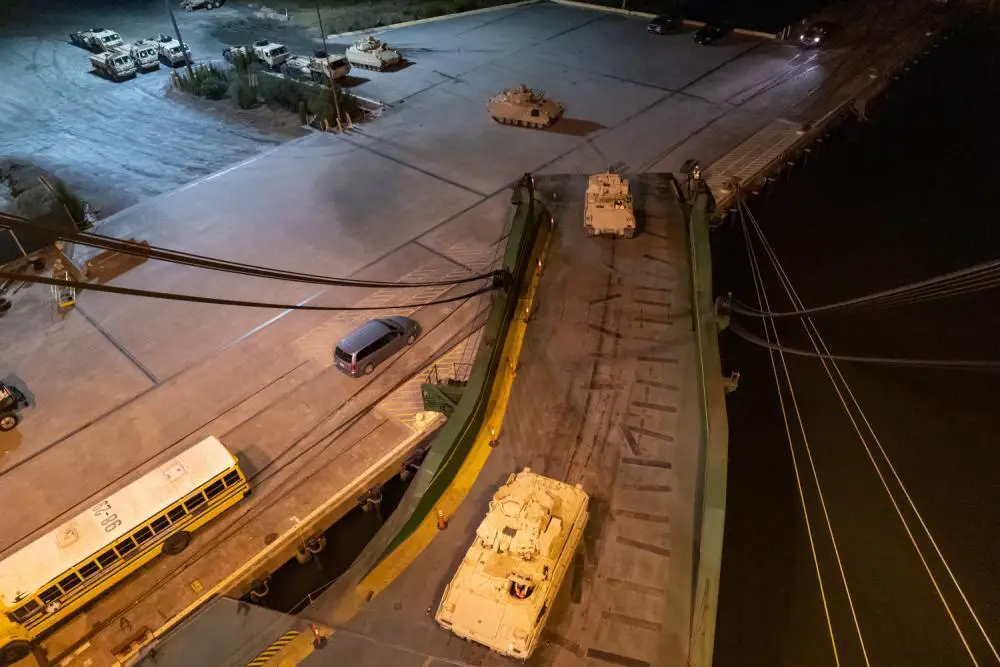 A convoy of Bradley Fighting Vehicles load onto the ARC Integrity Jan. 25, 2023, at the Transportation Core Dock in North Charleston, South Carolina. 