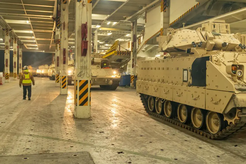 A convoy of Bradley Fighting Vehicles load onto the ARC Integrity Jan. 25, 2023, at the Transportation Core Dock in North Charleston, South Carolina.