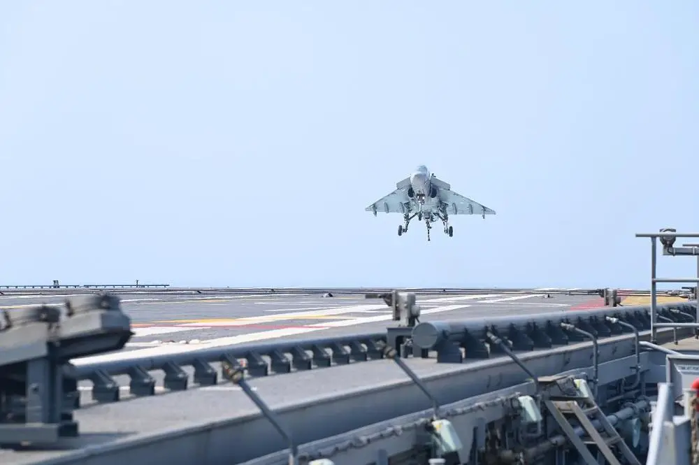 Naval variant of LCA lands first time on Indian Navy  aircraft carrier INS Vikrant 