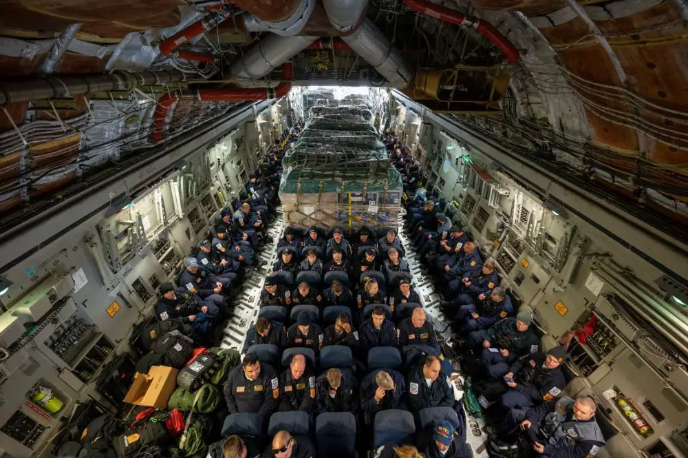 Urban Search and Rescue members from Fairfax County, Virginia, are boarded onto a C-17 Globemaster III on Dover Air Force Base, Delaware, Feb. 7, 2023.