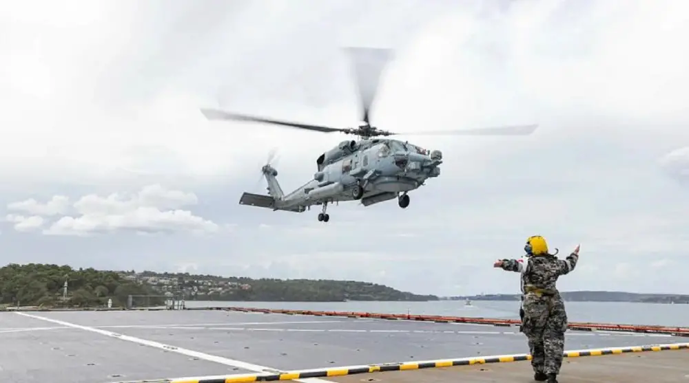 An MH-60R helicopter prepares to land on HMAS Choules’ flight deck. 