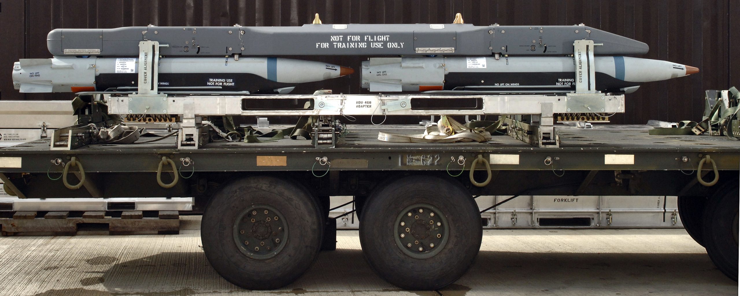 The Bomb Rack Unit 61 with carrier and four ground-training Guided Bomb Unit-39 small-diameter bombs on this munitions trailer undergoes testing at Royal Air Force Lakenheath, England.