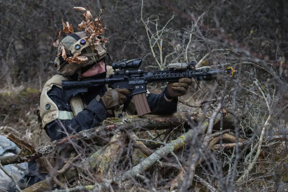 A U.S. Soldier, attached to 1st Battalion, 4th Infantry Regiment, acts as the opposing force during training for Royal Military Academy- Sandhurst (RMAS) cadets at the Hohenfels Training Area, Joint Multinational Readiness Center (JMRC) in Germany, March 17, 2022.