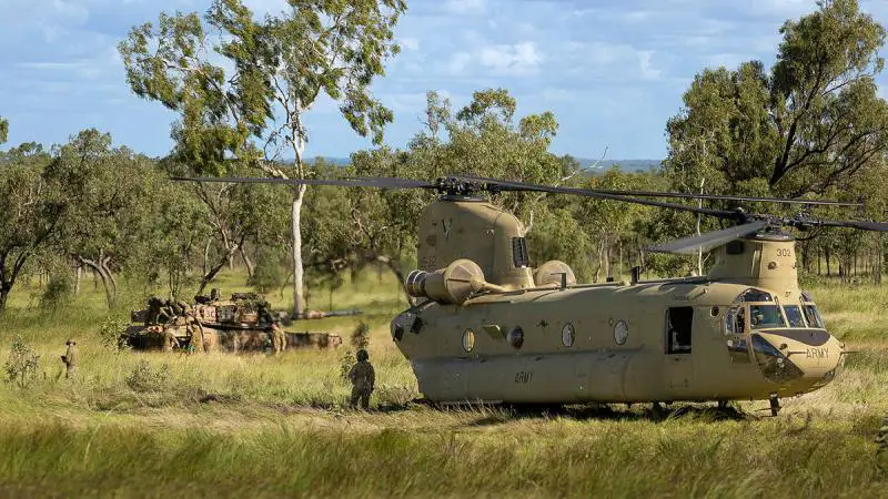 A CH-47 Chinook from the 5th Aviation Regiment conducts a refuel for the 2nd Cavalry Regiment’s M1 Abrams main battle tank at Townsville Field Training Area.
