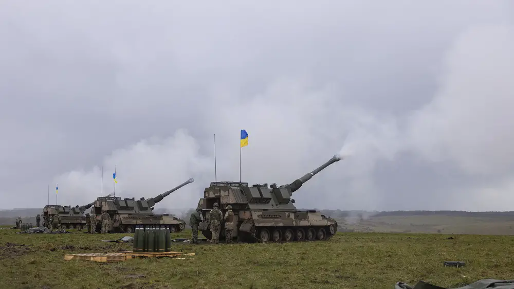 The Ukrainian AS90 crews fire their 155mm guns all at the same time. (Photo by Corporal Rob Kane/MoD Crown Copyright 2022)