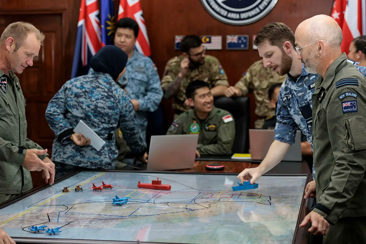 Royal Australian Air Force Flying Officer Jake Buchanan talks through training objectives during combined operations planning on Exercise BERSAMA SHIELD 2023 in Malaysia.
