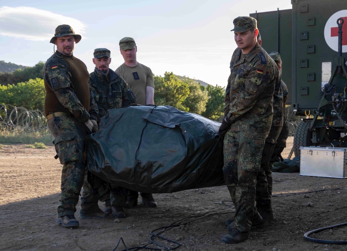 German military members assemble a medical tent during Exercise Noble Jump 2023 at VJTF Brigade Camp, Sardinia, Italy, April 27, 2023.  
