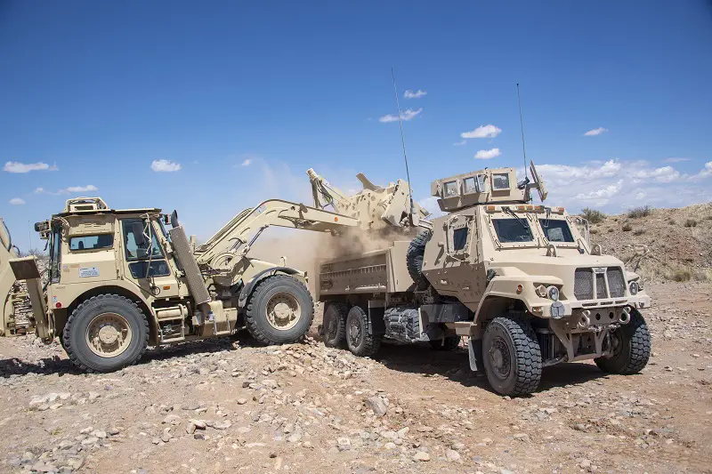 A dump truck configuration in the Family of Medium Tactical Vehicles, or FMTVA2, is loaded by Soldiers of the 16th Brigade Engineer Battalion, 1st Armored Combat Brigade Team, 1st Armored Division, as part of operational testing at Fort Bliss, Texas to determine operational effectiveness of the system and to enable decisions by Army senior leaders.