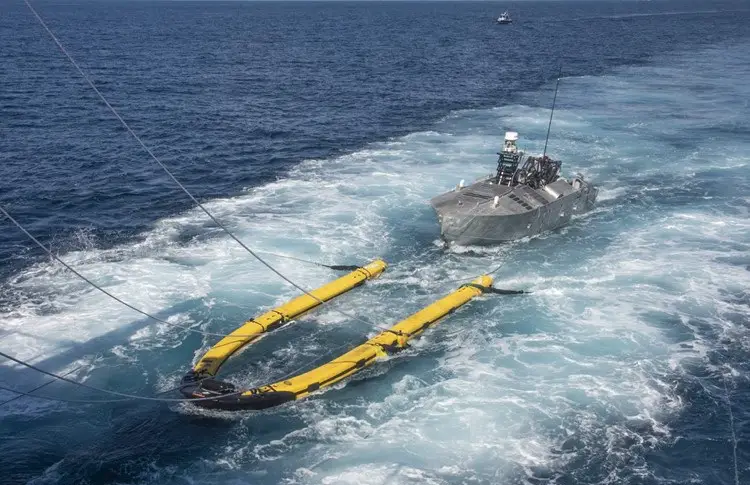 The Mine Countermeasures Unmanned Surface Vehicle (MCM USV) in Minehunt configuration performs launch and recovery operations during Initial Operational Test and Evaluation (IOT&E)