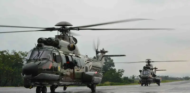 The Indonesian Air Force H225M Cougar helicopters in full combat SAR configuration.