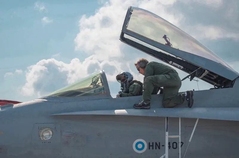 A Finnish Air Force Pilot and Crew Chief prepare to launch the F-18 Hornet during Exercise Air Defender 2023, June 21, 2023. 