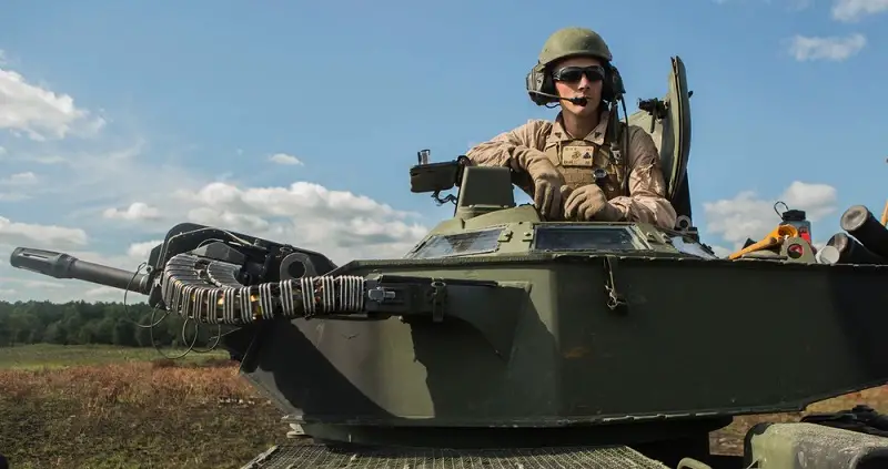 Marines with Alpha Company, 2nd Assault Amphibian Battalion, 2nd Marine Division, prepare to fire the Mk 19 Grenade Launcher on an AAV7A1 tracked vehicle during a live-fire exercise at Fort A.P Hill, Virginia