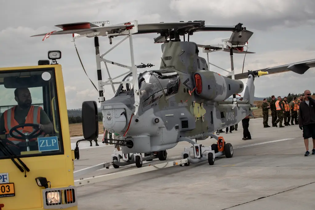The Czech air force's first two Bell AH-1Z attack helicopters are unloaded from the Boeing C-17 transport aircraft that delivered them to Vicar air base on Wednesday. 