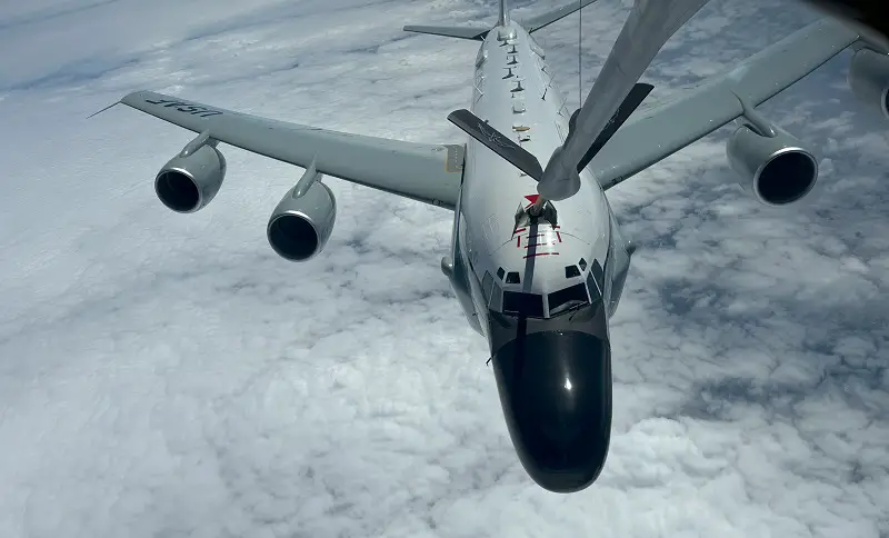 Metrea oeing KC-135 Stratotanker refuels U.S. Air Force Boeing RC-135 large reconnaissance aircraft.
