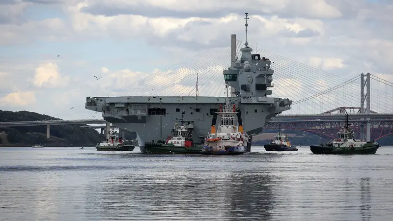 HMS Prince of Wales, the Royal Navy's second aircraft carrier, leaves Babcock's shipyard at Rosyth, in Scotland, after undergoing repairs lasting nine months. She will work up for several months, before resuming operations in the autumn. 