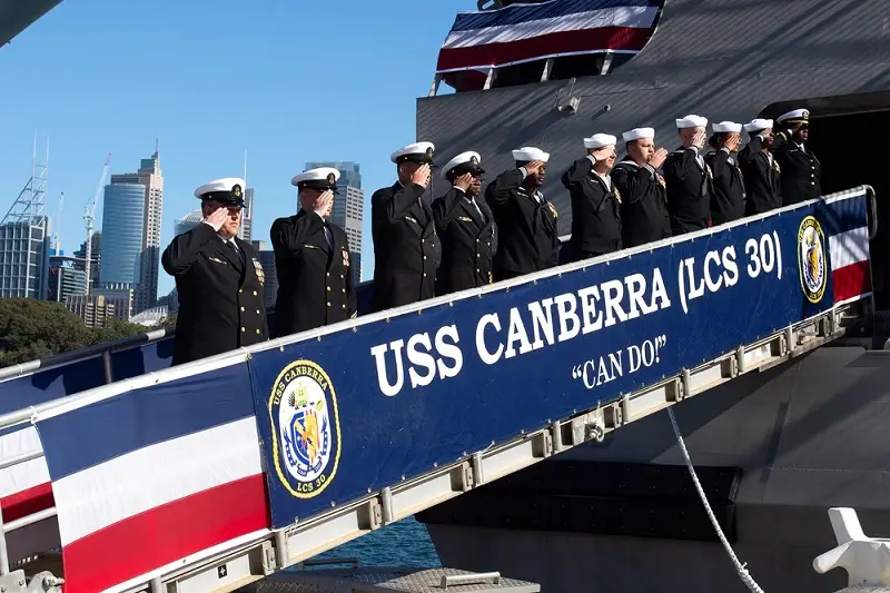Sailors salute during the commissioning ceremony of Independence-variant littoral combat ship USS Canberra (LCS 30) in Sydney, Australia July 22, 2023. 