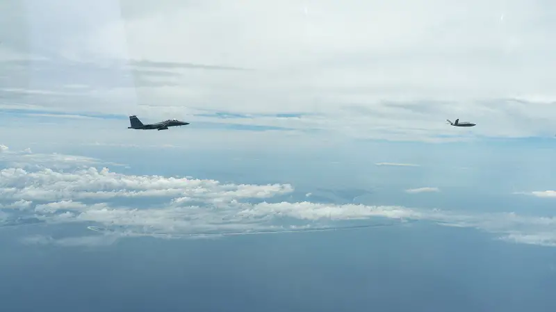 An F-15E Strike Eagle from the 96th Test Wing’s 40th Flight Test Squadron at Eglin AFB, Florida flies in formation with an XQ-58A Valkyrie flown by artificial intelligence agents developed by the Autonomous Air Combat Operations, or AACO, team from AFRL. The algorithms matured during millions of hours in high fidelity AFSIM simulation events, 10 sorties on the X-62 VISTA, Hardware-in-the-Loop events with the XQ-58A, and ground test operations. 