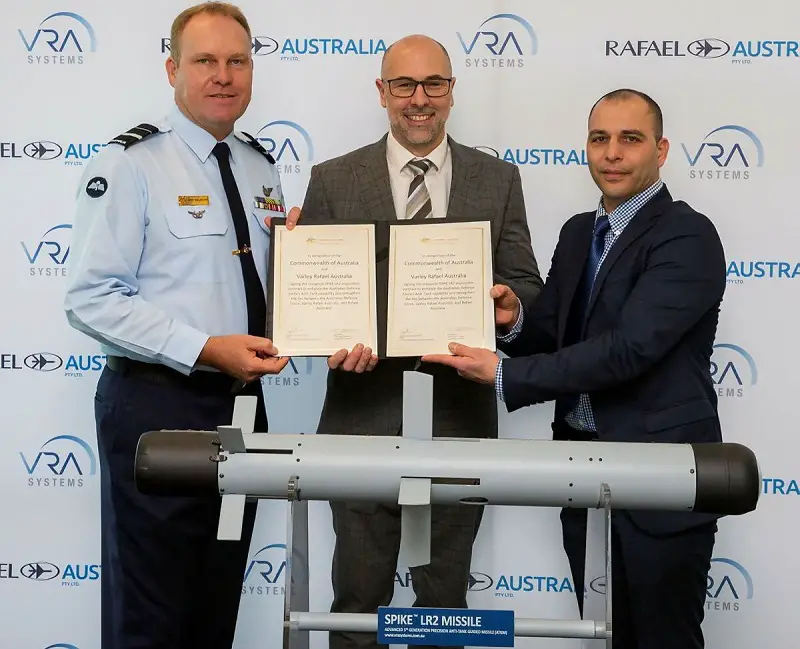 The head of Australia's new Guided Weapons and Explosive Ordnance (GWEO) group, Air Marshal Leon Phillips, poses with representatives of Israel's Rafael Advanced Defense Systems after signing a 'substantial' contract to buy Spike LR2 anti-tank missiles. 
