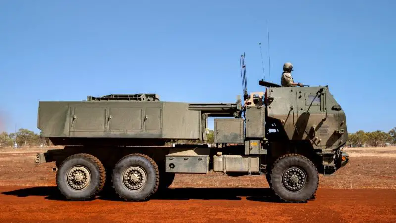 A US Army crewman commands an M142 high mobility artillery rocket system (HIMARS) to the firing point at Delamere Air Weapons Range, NT.