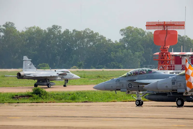 A Royal Thai Air Force JAS-39 Gripen and Royal Australian Air Force F/A-18F Super Hornets from No. 1 Squadron taxi to the runway for a sortie during Exercise Thai Boomerang 23 at Korat Royal Thai Air Force Base, Thailand.