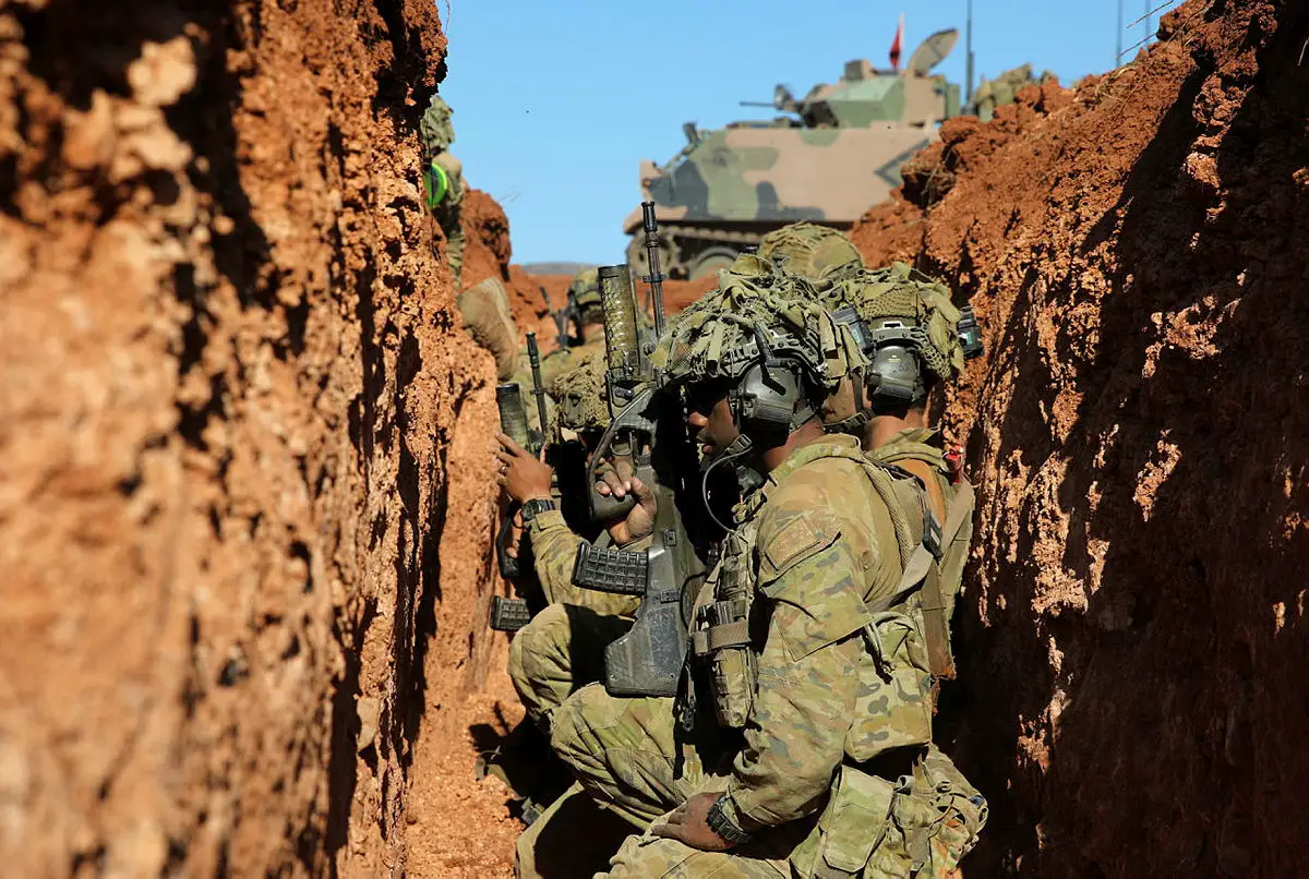 Australian Army soldiers from the 7th Battalion, The Royal Australian Regiment prepare to clear a trench system at Cultana Training Area, South Australia during Exercise Southern Tiger 2023.