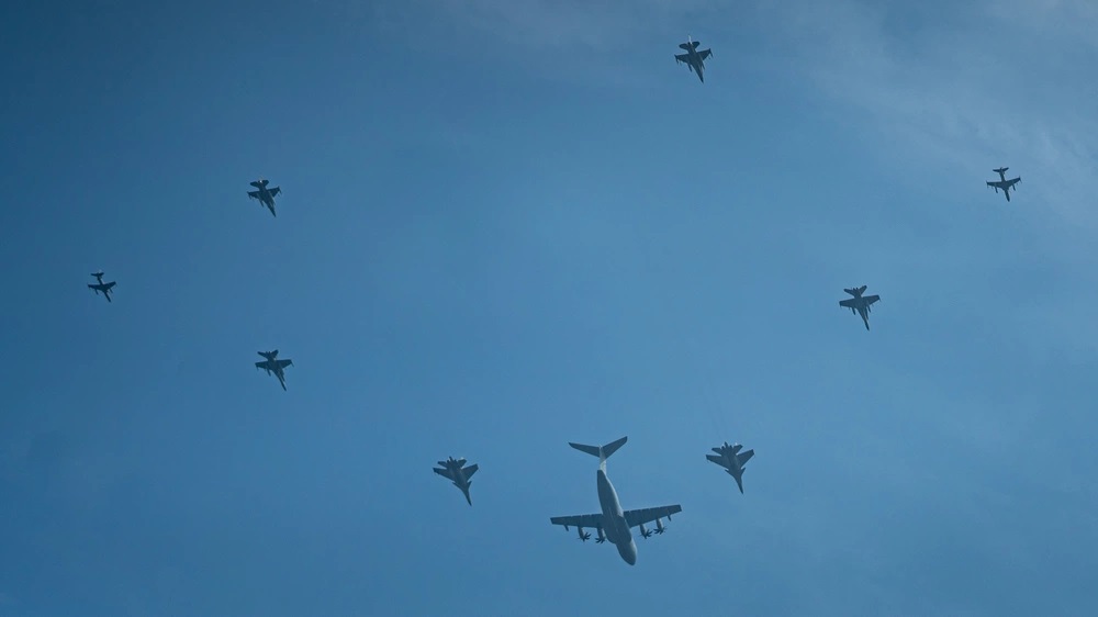 U.S. and Royal Malaysian Air Force aircraft fly in a nine-ship formation during a photo exercise while conducting bilateral operations to ensure readiness during Cope Taufan 23 at RMAF P.U. Butterworth, Malaysia, Sept. 28, 2023.