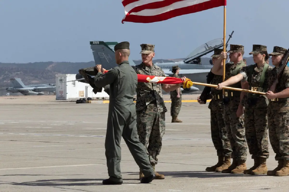 U.S. Marine Corps Lt. Col. Ryan J. Franzen (left), commanding officer of Marine Fighter Attack Training Squadron (VMFAT) 101, Marine Aircraft Group 11, 3rd Marine Aircraft Wing, and Sgt. Maj. Jonas Johnson (center), sergeant major of VMFAT-101, MAG-11, 3rd MAW, case their squadron’s colors during VMFAT-101's deactivation ceremony at Marine Corps Air Station Miramar, California, Sept. 29, 2023.