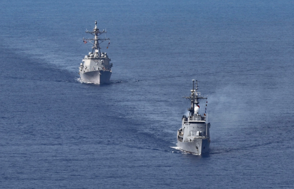 Photo by Petty Officer 1st Class Gregory Johnson 
 The Arleigh Burke-class guided-missile destroyer USS Dewey (DDG 105), left, steams in formation with the Philippine Navy offshore patrol vessel BRP Gregorio del Pilar (PS 15)
